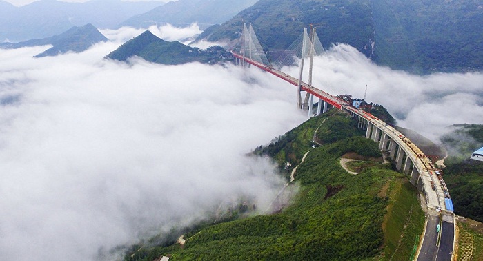 Above the clouds: China builds world`s highest bridge